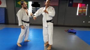 Two Male Judokas Teaching Judo