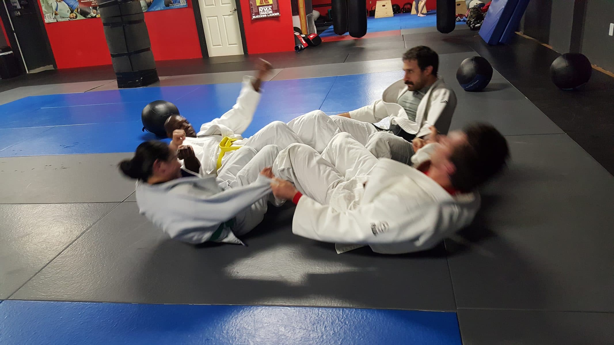 judo students doing sit-ups together